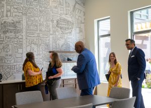 Tour participants getting a look at the special mural on the wall in one of the common rooms. 