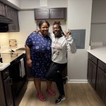 Two residents pose for a picture in the new kitchen at Beechwood for the open House